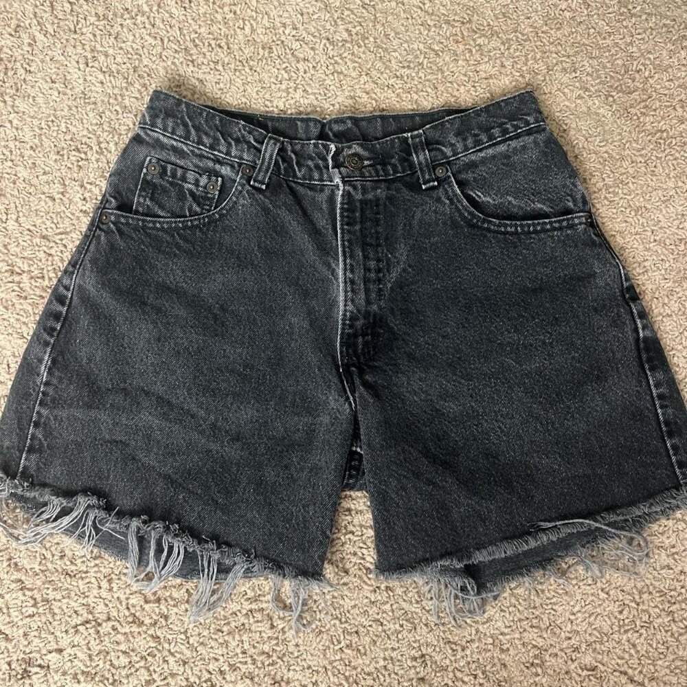 Vintage 90’s Levi’s black denim shorts with frayed bottom